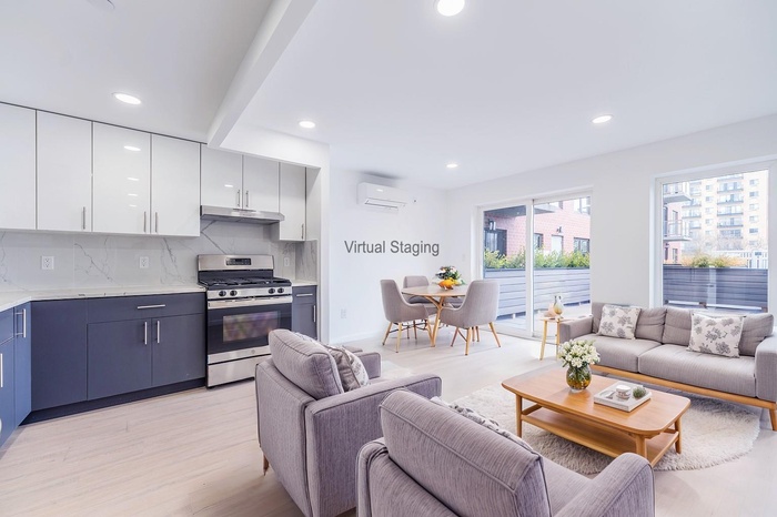 Living area featuring recessed lighting, light wood-style floors, and a wall mounted AC