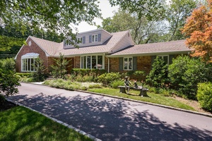 Welcome to 14 Pine Drive, a stately 4 bedroom, 6 bathroom residence nestled in the prestigious Hunting Hill community of Woodbury.
