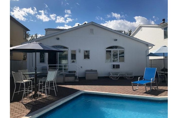Back of house with a patio, a gazebo, entry steps, and an outdoor pool