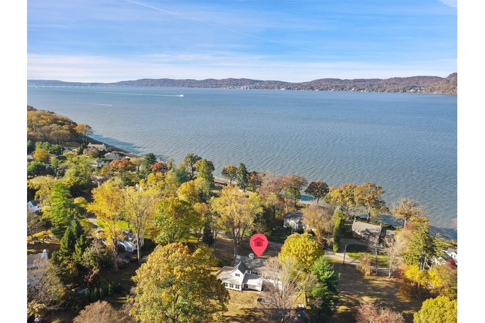 View of property location with a water and mountain view