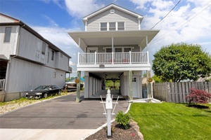 Magnificent, stunning Waterfront Home situated deep into Seaford Harbor overlooking Seamans Neck Park, across from canal w no neighbors, 5 minute boat ride to Great South Bay, 34 feet of ...