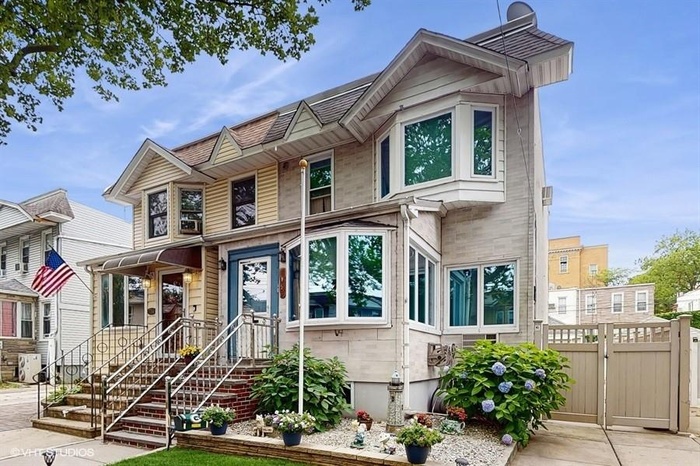 View of front of house with a gate