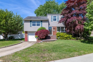 Welcome to this beautifully maintained split level gem !