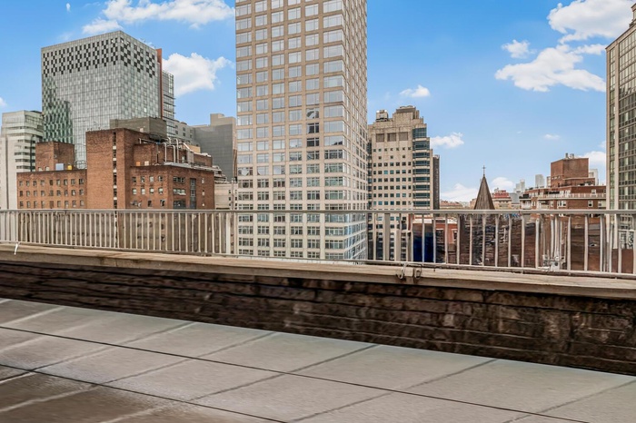 View of patio / terrace featuring a city view and a balcony
