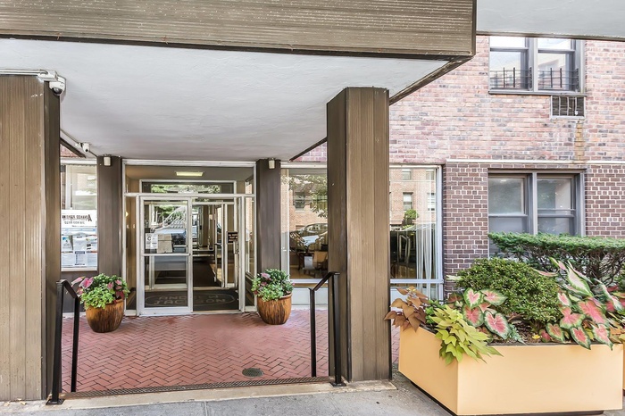 Entrance to property with brick siding