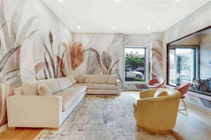 Living room with recessed lighting and wood finished floors
