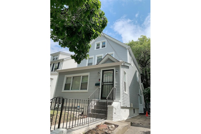 View of front of property with a fenced front yard