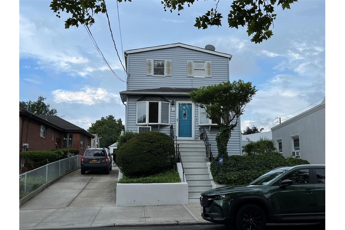 View of front of home featuring concrete driveway
