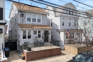 This fully renovated two family home offers modern updates and a versatile layout.