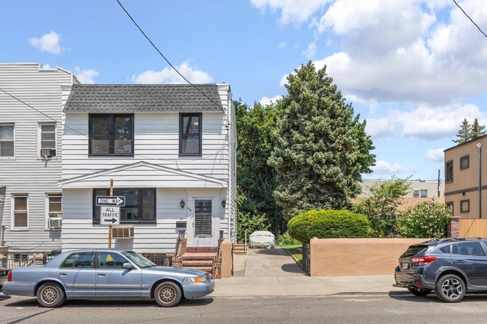 View of front of property featuring roof with shingles