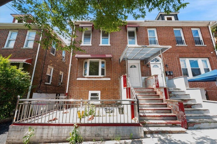 View of front of property featuring brick siding