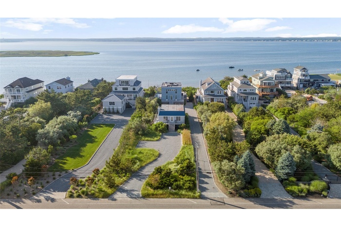 Aerial view of residential area with a large body of water