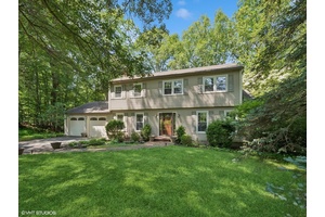 Set on a peaceful, dead end street, this classic Colonial offers a rare blend of privacy, livable space, and natural beauty.