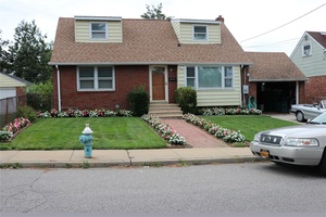 Well Maintained 4 bedroom, 2 Baths Cape Cod Home, Located in the heart of Elmont.
