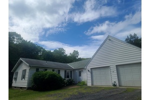 LIVING IS EASY in this low maintenance luxury ranch on almost 8 acres of privacy and tranquility.