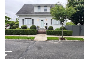Beautifully maintained and spacious, this stunning one family Cape sits on a high, oversized corner lot in prime Little Neck, within top rated School District 26 and R3 zoning.