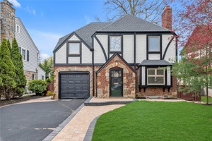 This classic brick renovated Tudor style home is located in the heart of Rockville Centre Village and awaits it's new owner.