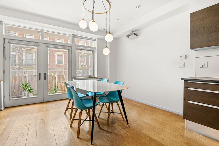 Dining room featuring french doors, recessed lighting, baseboards, and light wood-type flooring