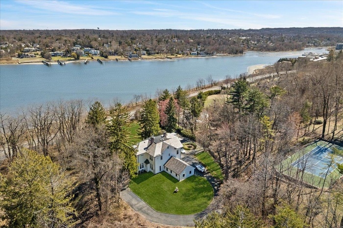 Bird's eye view with a water view and a forest view