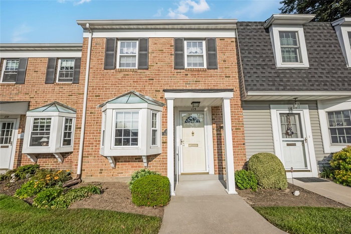 View of front of home with brick siding