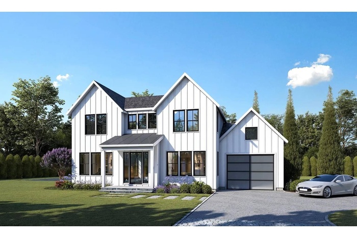 Modern farmhouse style home featuring board and batten siding, a front yard, and driveway