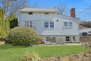 Charming and unique Colonial home featuring a welcoming living room, a spacious country kitchen perfect for gatherings and a convenient first floor bedroom and full bathroom.