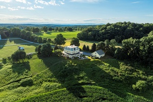 This architecturally distinctive Millbrook home was authentically built in the Second Empire Victorian period style in 1994.