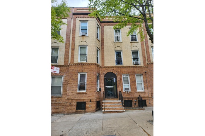 View of building exterior with cooling unit and entry steps