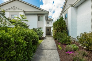 The living really is easy in this totally renovated, pristine, spacious and bright two bedroom, two bath condo located in the Bennett Common Community.