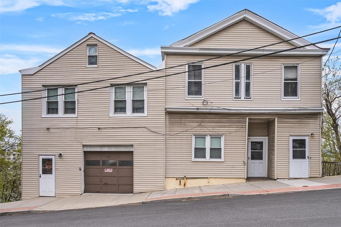 View of front of home featuring an attached garage