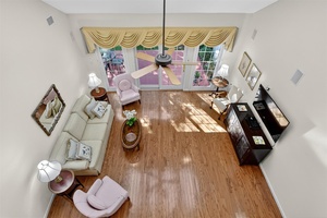 Nestled within the desirable 55 gated community of Mill Pond Acres, this elegant end unit New Englander Model home offers comfort, convenience, and a serene setting.