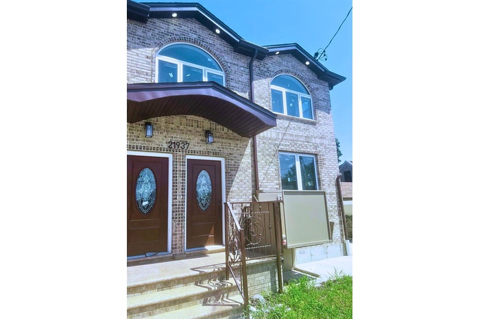 Entrance to property with brick siding