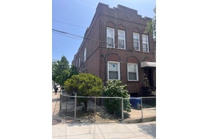 Corner detached brick 4 family building.
