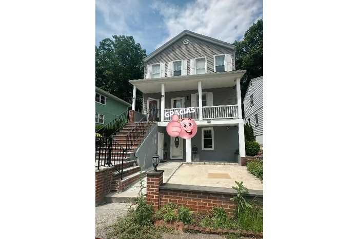 View of front of house with covered porch and stairs
