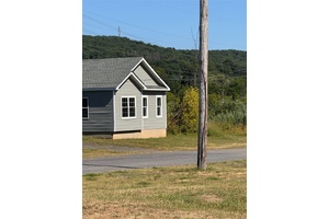 7. 5 acre currently 55 mobile home trailer park with 32 lots plus a 20x30 store front and a 3 car garage.