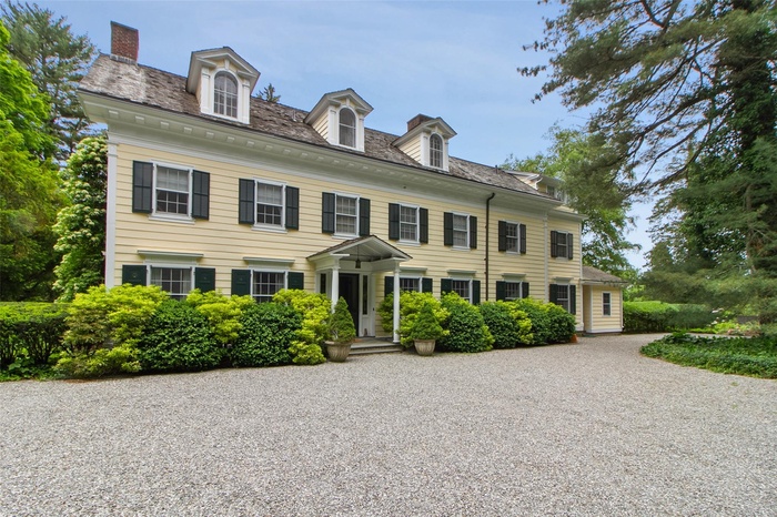 The front of the house highlighting the architecture and the classic third floor.