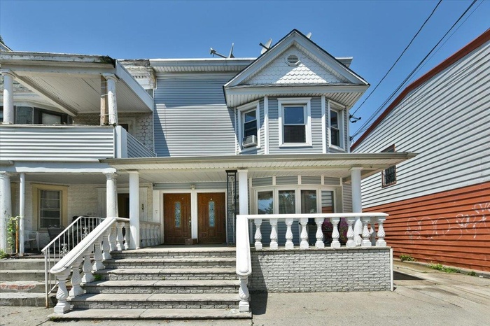 Victorian home featuring a porch