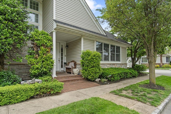 View of exterior entry featuring stone siding