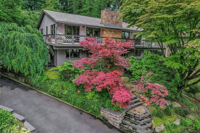 View of front of house featuring a chimney