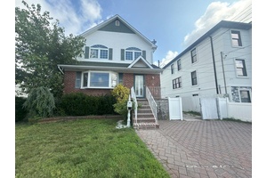 Large expanded cape style home on a dead end street with full basement, detached garage, spacious rooms, and amazing potential.