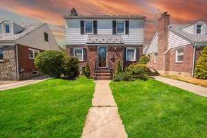Welcome to this beautifully maintained 4 bedroom, 2 bath colonial nestled on an oversized 40x118 lot in the heart of Fresh Meadows.