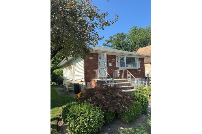 View of front of property with brick siding