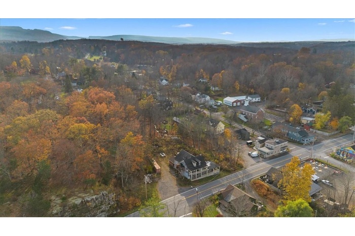Birds eye view of property with a mountain view