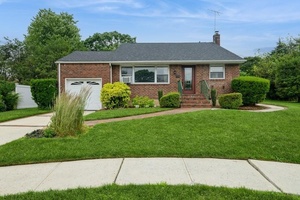 Welcome to 6 Robert Court a beautifully maintained and character rich home nestled in a quiet cul de sac in the heart of Bethpage.