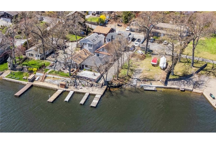 Ariel view of home, beach & dock area.  Summer shot.