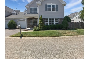 Welcome to 5 Lori Ln, a beautifully maintained townhome nestled in the sought after 24 hour gated community of Birchwood at Spring Lake.
