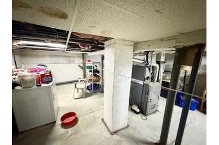 Unfinished basement with heating unit
