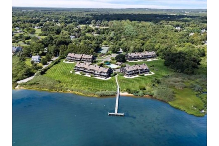 Bird's eye view of a large body of water and a heavily wooded area