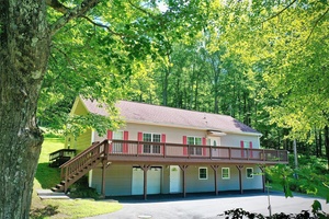 Looking for a beautifully maintained, open floor plan, contemporary home with a huge deck and a view ?