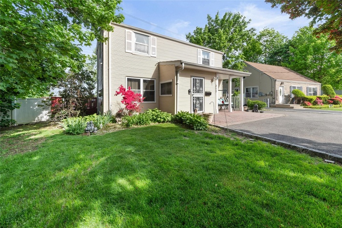 Rear view of property featuring a patio